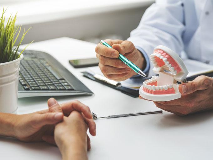 Explaining dental procedure to patient